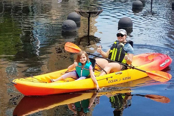 a small yellow boat on a body of water